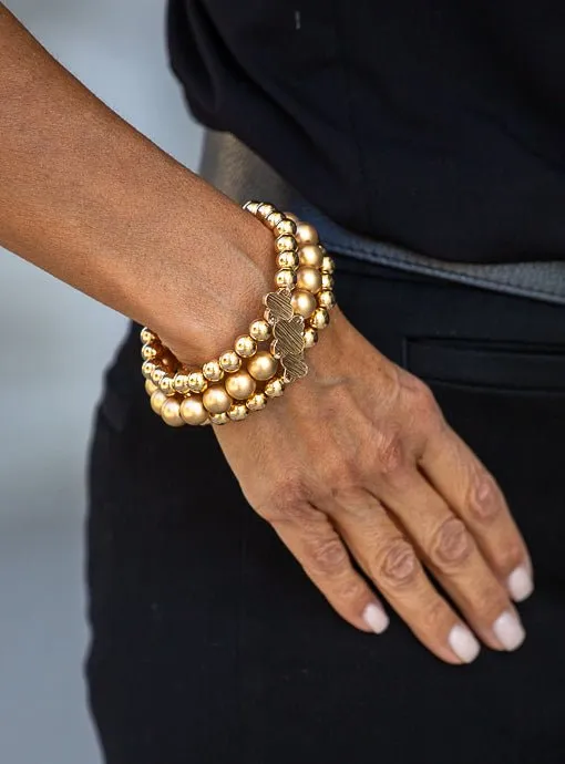 Matte And Shiny Gold Three Piece Bracelet Set With Clover