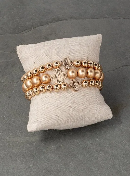 Matte And Shiny Gold Three Piece Bracelet Set With Clover